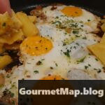 Deconstrucción de un barquito de bogavante, huevo frito, patatas fritas y ajo